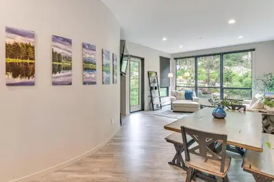 a living room with a table and chairs at Ski-InandSki-Out! Winter Park Family Gem with Hot Tub in Winter Park