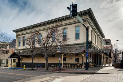 a building on the corner of a street with a traffic light at Shop, Dine, Unwind! Couples Retreat in Dtwn Golden in Golden