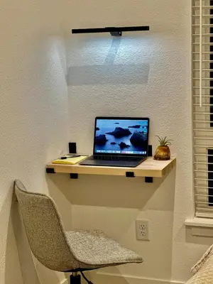 a laptop computer sitting on a shelf on a wall at New TownHome Downtown Westminster 4-6 Guests in Westminster
