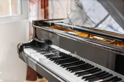 a piano is sitting in a room at NEW Olde Town Arvada 5BR Luxe Mini Golf Hot Tub Arcade Cinema Gym in Arvada