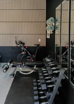 a gym with a bunch of equipment in a room at Luxury 5BR - Hot Tub - Game Garage - Mini Golf in Denver