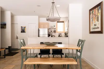 a kitchen and dining room with a wooden table and chairs at Lakefront Keystone Escape - Near Slopes & Trails in Keystone