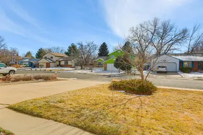 a residential neighborhood with a tree in a yard at 4 Mi to Dtwn Loveland Home with Hot Tub and Yard in Loveland