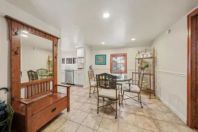 a kitchen and dining room with a table and chairs at Twin Fawns cabin in Estes Park