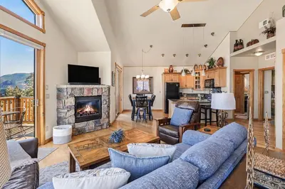 a living room with a couch and a fireplace at Lakeview Retreat 19A condo in Estes Park