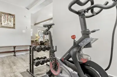a gym with an exercise bike in a room at Black Hawk Getaway with Hot Tub cabin in Black Hawk