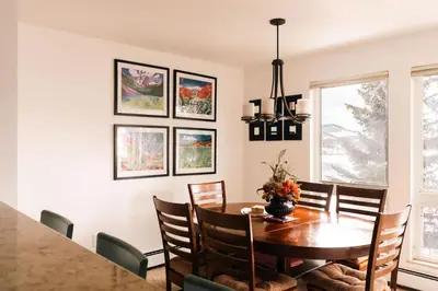 a dining room with a table and chairs at Spacious Family Condo - Walk to Dillon Reservoir in Dillon