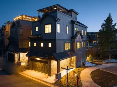 a large black house with lights on it at Home Spa Retreat Downtown WP Walk to Shops Dining in Winter Park