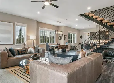 a living room with a couch and a dining room at Home Spa Retreat Downtown WP Walk to Shops Dining in Winter Park