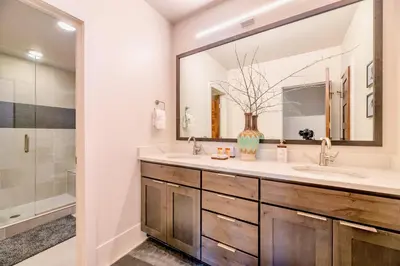 a bathroom with two sinks and a large mirror at Luxury Mountain Winter Getaway w Beautiful Views in Silverthorne