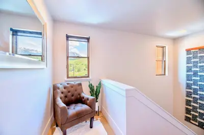 a stairway with a chair in a room at Luxury Mountain Winter Getaway w Beautiful Views in Silverthorne