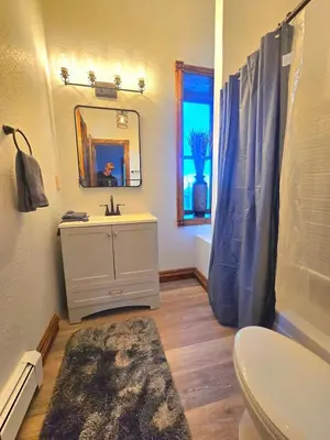 a bathroom with a sink and a mirror at Historic Mining Manor in the Colorado Rockies in Central City