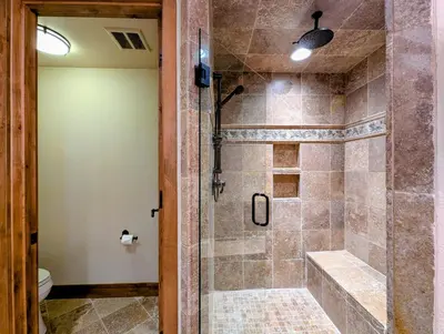 a walk in shower in a bathroom with a glass door at Enclave 37 by SummitCove Lodging in Snake River Health Services Incorporated Heliport