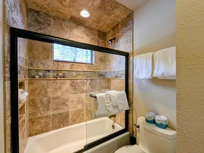 a bathroom with a bath tub and a toilet at Enclave 37 by SummitCove Lodging in Snake River Health Services Incorporated Heliport