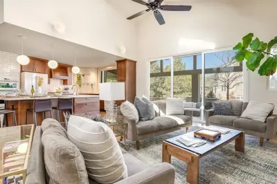 a living room with a couch and a table at Mid-Century Mod - 7 BR Sleeps 22 - Hot Tub & Game Room in Westminster