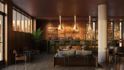 a restaurant with tables and chairs and a bar at All Inn in Denver
