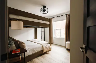 a bedroom with a bed and a large window at Refined Riverfront Living - King Suite & Views in Silverthorne