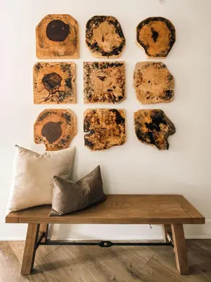 a wooden bench in front of a wall with fossils at Refined Riverfront Living - King Suite & Views in Silverthorne