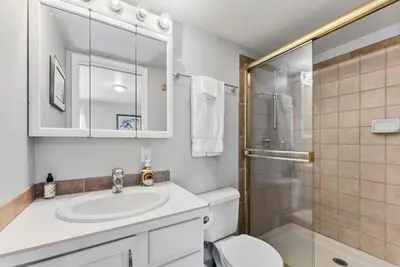 a bathroom with a sink and a toilet and a shower at Treehouse C106 - Renovated Condo with Great Amenities, Central Summit County Location in Silverthorne