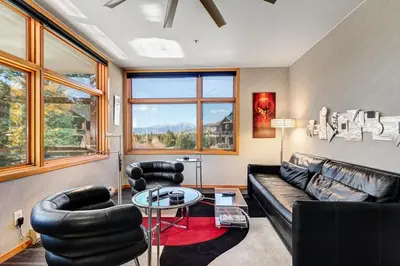 a living room with a couch and chairs and a table at River Bank Lodge 2916 in Snake River Health Services Incorporated Heliport