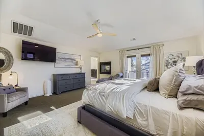 a bedroom with a large bed and a window at 6BR Luxury Denver Retreat-Sleeps -14 - 7 Baths in Denver