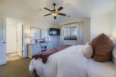 a bedroom with a bed and a ceiling fan at 6BR Luxury Denver Retreat-Sleeps -14 - 7 Baths in Denver