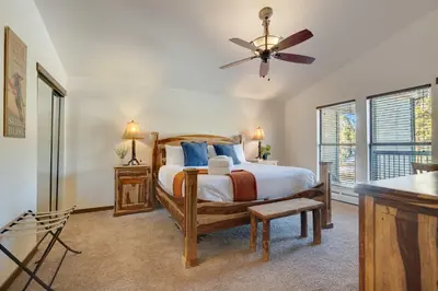 a bedroom with a bed and a ceiling fan at Hygge Haus - 2BD Lake View & Pet Friendly Retreat in Dillon