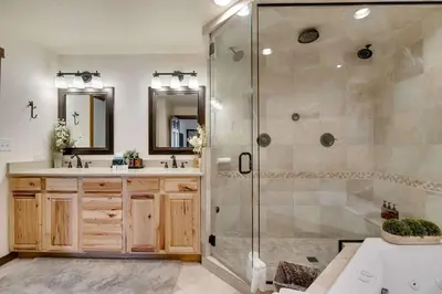 a bathroom with a shower and two sinks at Hygge Haus - 2BD Lake View & Pet Friendly Retreat in Dillon