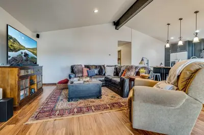 a living room with a couch and a table at Hygge Haus - 2BD Lake View & Pet Friendly Retreat in Dillon