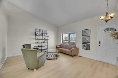 a living room with a couch and a chair at Your Home Away From Home ! in DEN