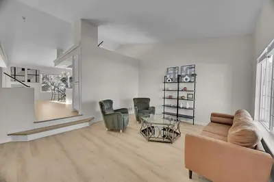 a living room with a couch and two chairs at Your Home Away From Home ! in DEN