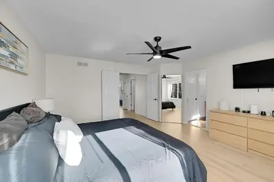 a bedroom with a bed and a ceiling fan at Your Home Away From Home ! in DEN