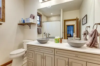 a bathroom with two bowls on the counter at Ride-InandRide-Out Grand Lake Hub Near Lakes and RMNP in Grand Lake