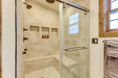 a shower with a glass door in a bathroom at Ride-InandRide-Out Grand Lake Hub Near Lakes and RMNP in Grand Lake