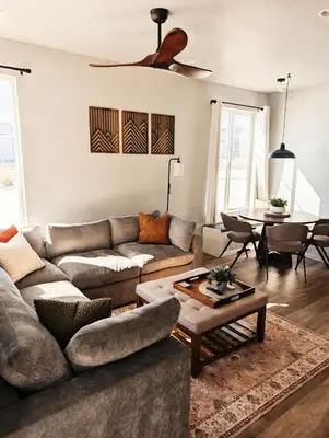 a living room with a couch and a table at Cozy Mountain View Getaway! in Arvada