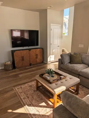 a living room with a couch and a tv at Cozy Mountain View Getaway! in Arvada