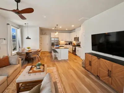 a living room with a large flat screen tv at Cozy Mountain View Getaway! in Arvada