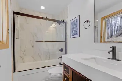 a bathroom with a shower and a sink and a toilet at Pedal and Peak 113A townhouse in Dillon