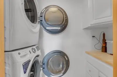 a washing machine and a dryer in a kitchen at Pedal and Peak 113A townhouse in Dillon