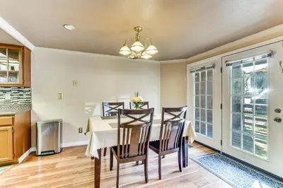a kitchen and dining room with a table and chairs at Extended Stay in Denver Area! Pet-Friendly Retreat in Aurora