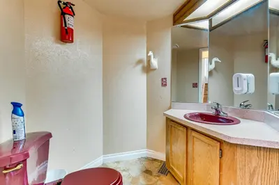 a bathroom with a red sink and a mirror at Extended Stay in Denver Area! Pet-Friendly Retreat in Aurora