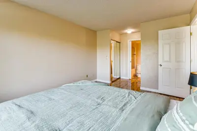 a bedroom with a large bed in a room at Extended Stay in Denver Area! Pet-Friendly Retreat in Aurora