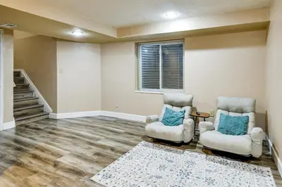 two chairs and a table in a living room at Extended Stay in Denver Area! Pet-Friendly Retreat in Aurora