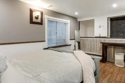a bedroom with a bed and a fireplace at Extended Stay in Denver! Cozy Apartment with Patio in Denver