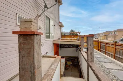 a house is being built on a balcony at Extended Stay in Denver! Cozy Apartment with Patio in Denver