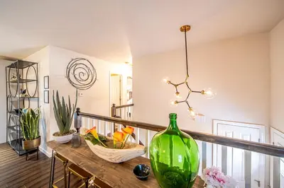 a green vase sitting on a table in a room at Amazing Lake View Heated Pool Swim Spa and Hot Tub in Thornton