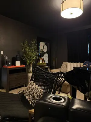 a living room with a couch and a chair at Amazing Lake View Heated Pool Swim Spa and Hot Tub in Thornton