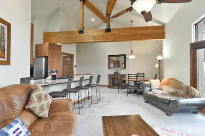 a living room with a couch and a table at Marina Park Mountain View Townhome: Heart of Frisco in Frisco
