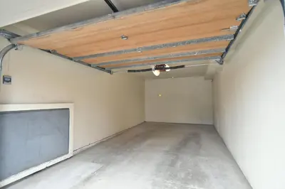 an empty garage with a wooden ceiling at Marina Park Mountain View Townhome: Heart of Frisco in Frisco