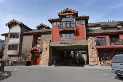 a large house with a red at Marina Park Mountain View Townhome: Heart of Frisco in Frisco